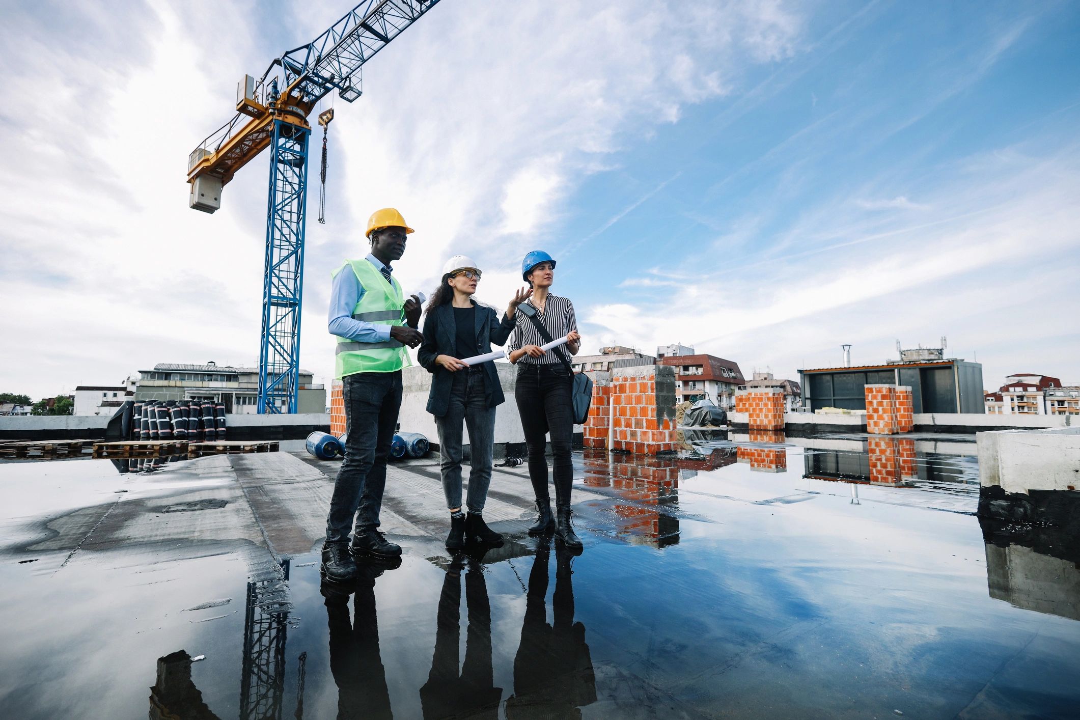 Team reviewing plans at a construction site