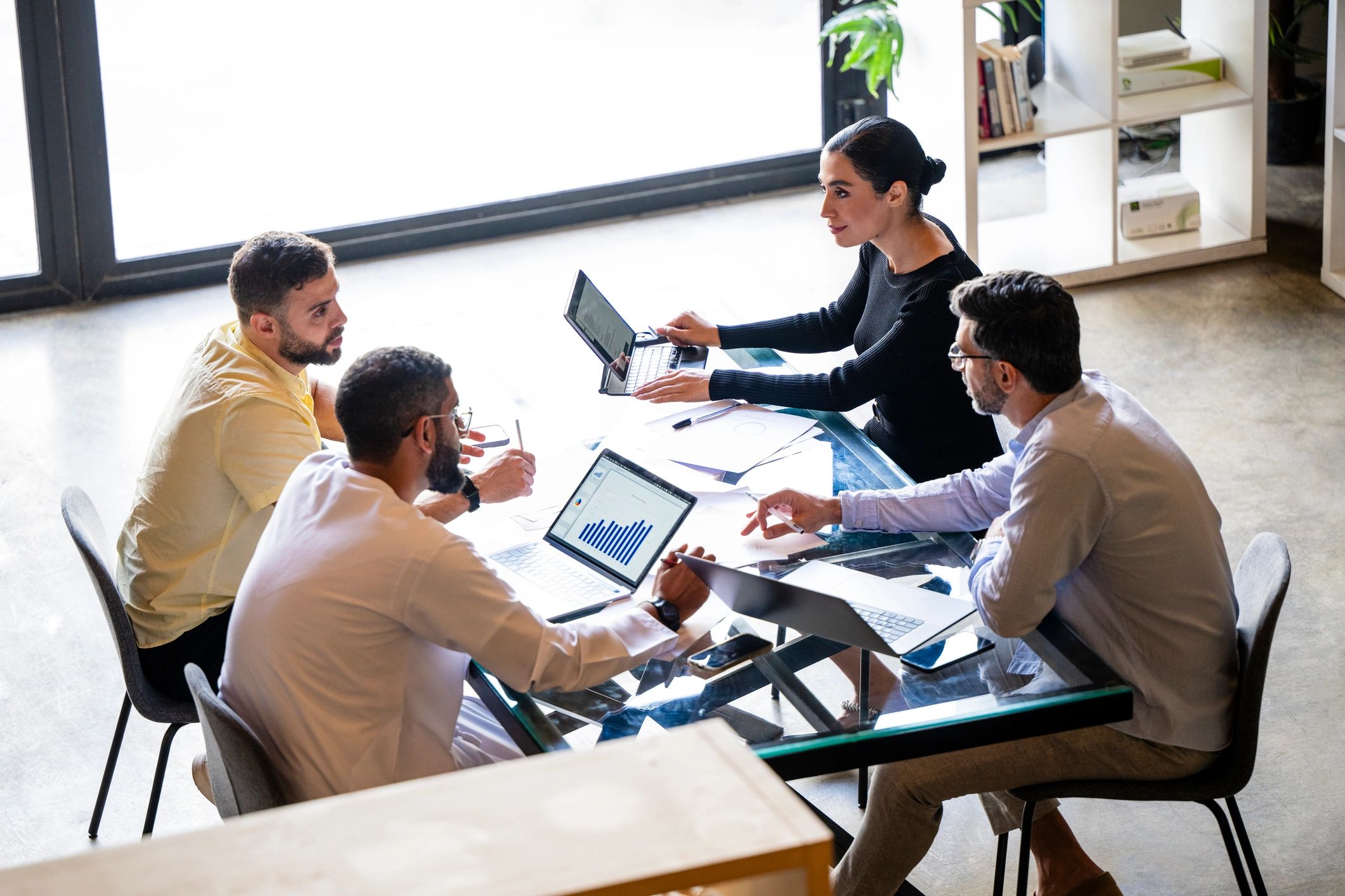 Team reviewing staffing and operations plans in a modern workspace