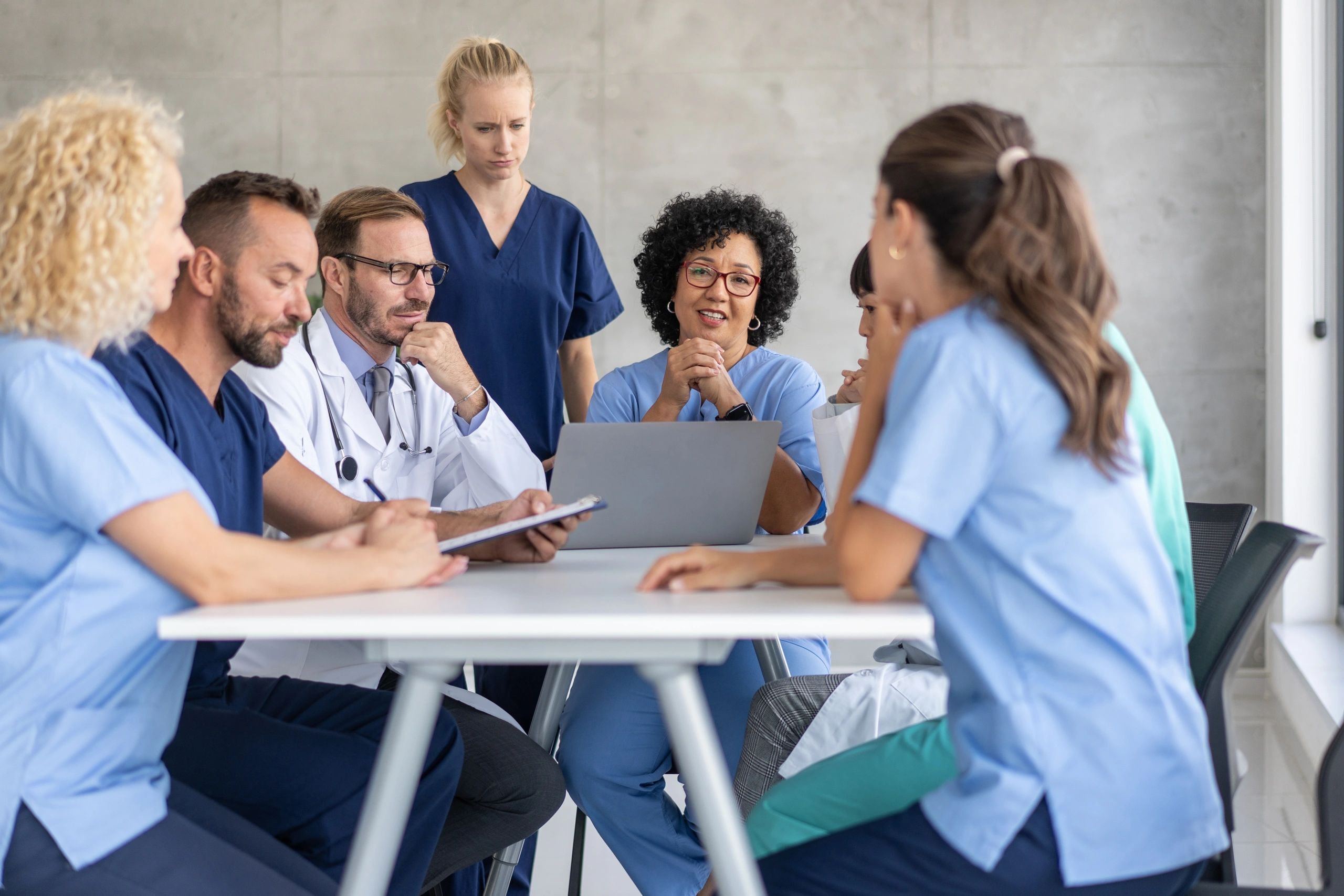 Healthcare professionals collaborating on care coordination
