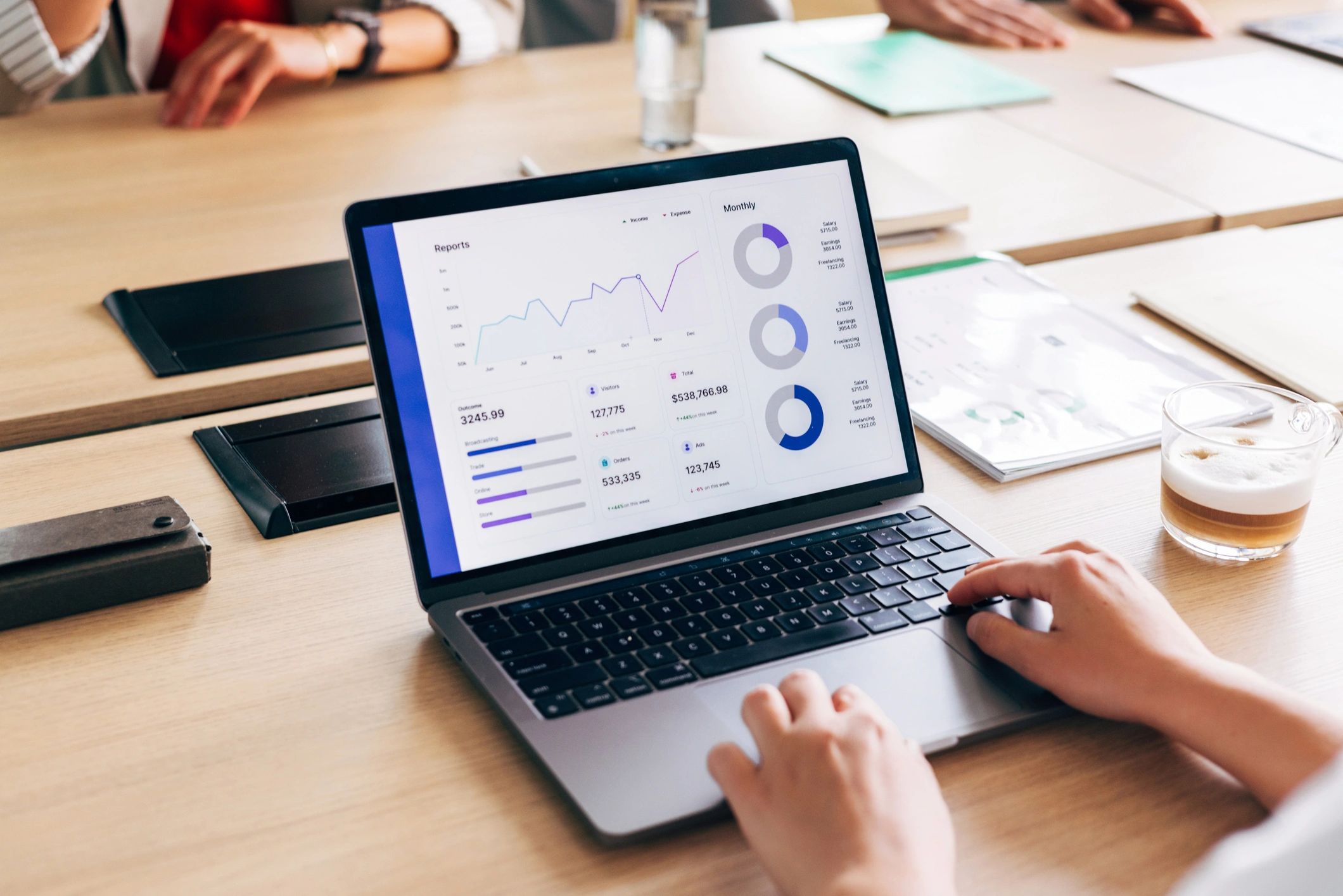 Professional analyzing service coordination data on a laptop
