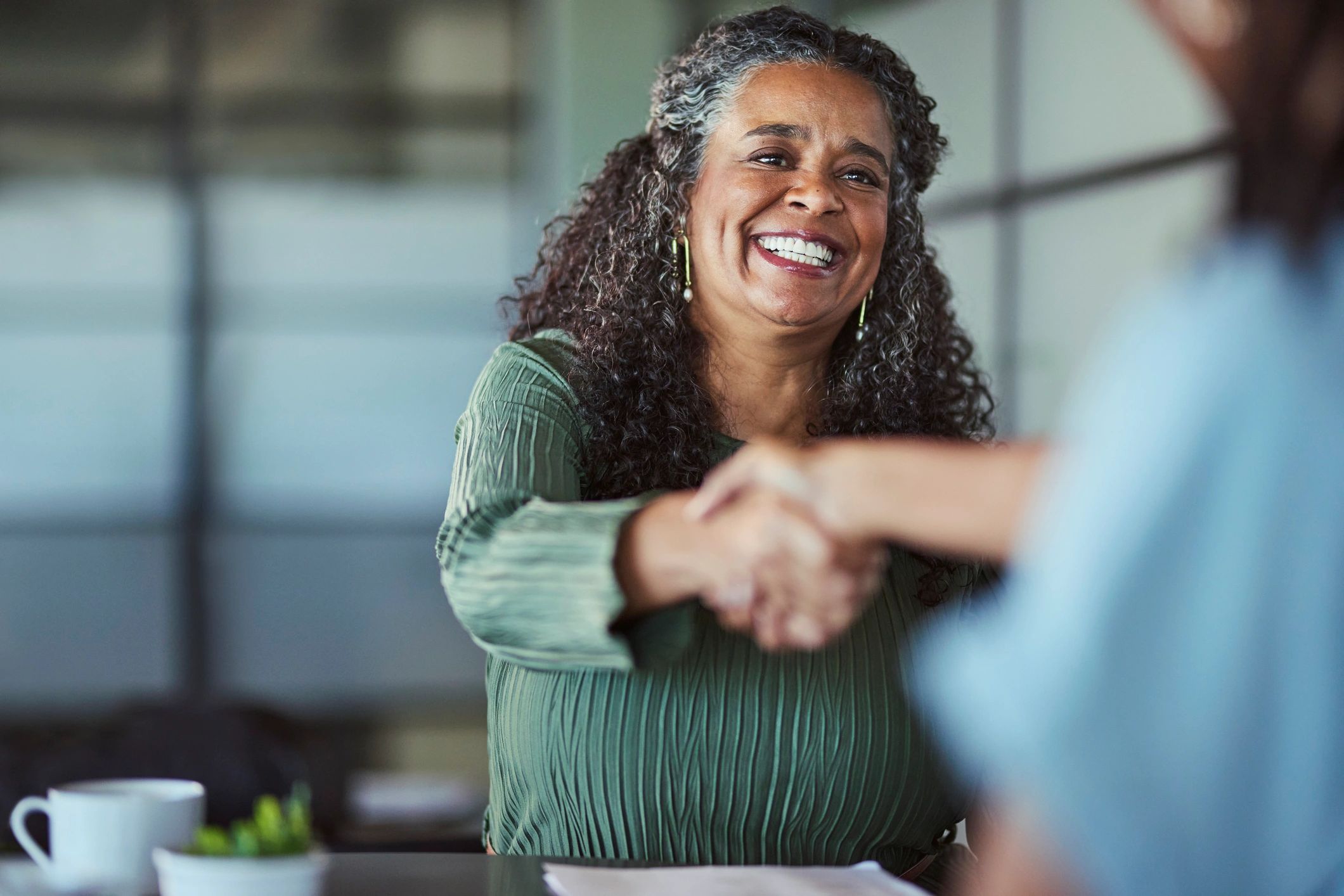 Professional handshake during an interview or agreement