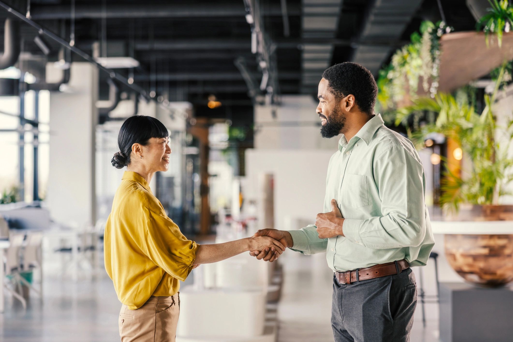 Business people shaking hands celebrating partnership
